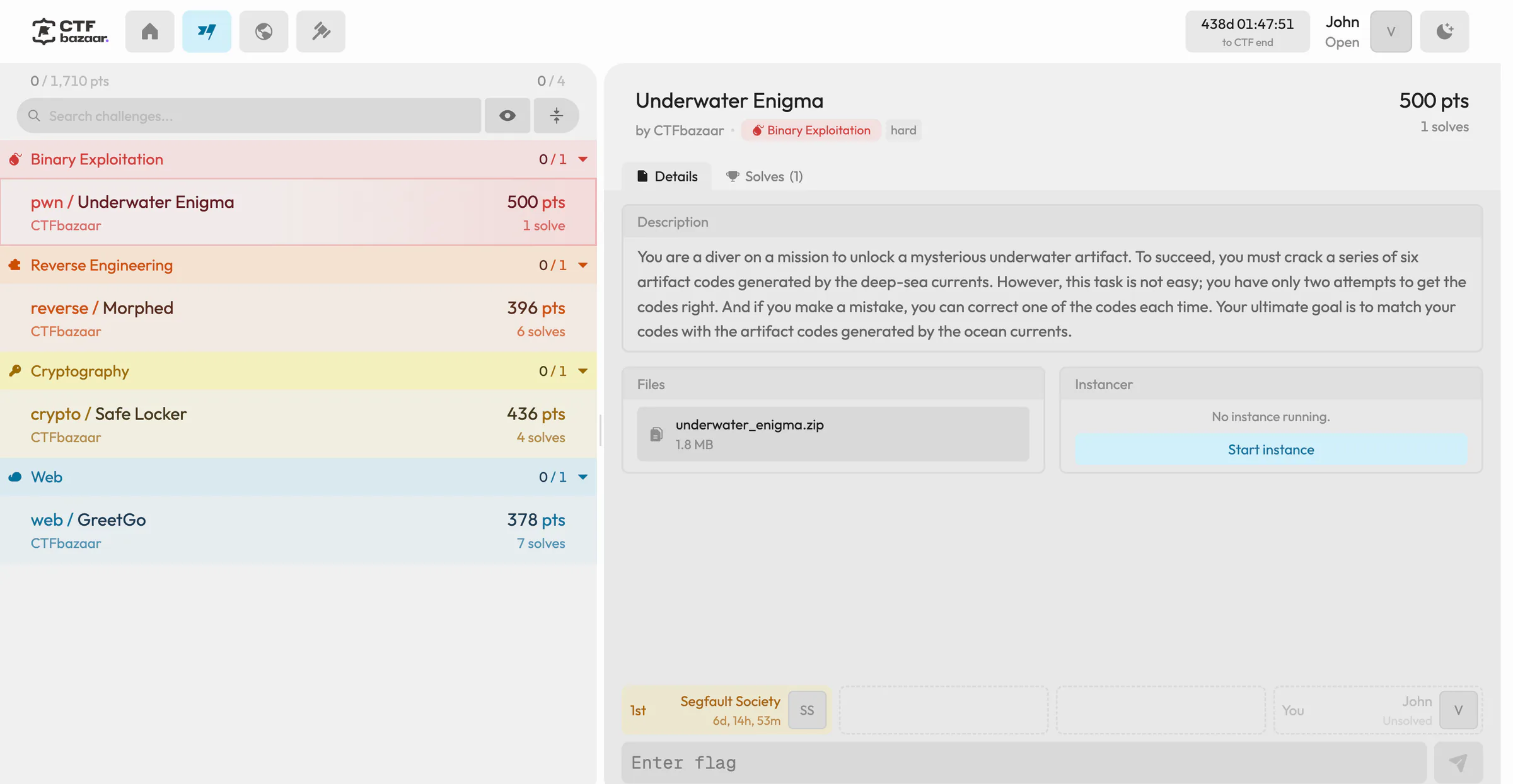 The CTF challenge view: challenges grouped by category with points and solves on the left, and the selected Underwater Enigma challenge with its description, files, instancer and flag input on the right.